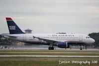 N760US @ KSRQ - US Air Flight 2090 (N760US) departs Sarasota-Bradenton International Airport enroute to Charlotte-Douglas International Airport - by Donten Photography