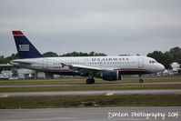 N746UW @ KSRQ - US Air Flight 2015 (N746UW) arrives at Sarasota-Bradenton International Airport following a flight from Charlotte-Douglas International Airport - by Donten Photography
