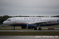 N746UW @ KSRQ - US Air Flight 2015 (N746UW) arrives at Sarasota-Bradenton International Airport following a flight from Charlotte-Douglas International Airport - by Donten Photography
