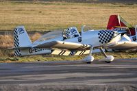 G-EGRV @ EGFH - Resident RV-8 in the newly applied markings of Team Raven formation aerobatic display team. Another aircraft in the team (G-VFDS) has been simularly marked and is behind G-EGRV. - by Roger Winser