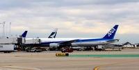 JA778A @ KORD - Gate M9 ORD - by Ronald Barker