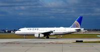 N415UA @ KORD - Landing ORD - by Ronald Barker