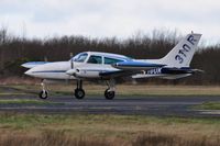 N310UK @ EGFH - Visiting 310R arriving Runway 22. - by Roger Winser