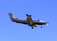 C-GKRY @ CYXX - Landing... side view - by Guy Pambrun
