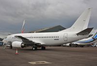 N463AC @ EGHH - Waiting for its turn in the paintshop - by John Coates