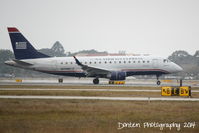 N819MD @ KSRQ - US Air Flight 3346 operated by Republic (N819MD) arrives at Sarasota-Bradenton International Airport following a flight from Reagan National Airport - by Donten Photography