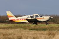 G-AXZF @ EGFH - Resident Cherokee operated by Cambrian Flying Club holding prior to a local flight. - by Roger Winser