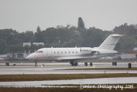 N988JC @ KSRQ - Bombardier Challenger 600 (N988JC) taxis at Sarasota-Bradenton International Airport - by Donten Photography