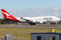 VH-OEH @ YSSY - TAXI FROM 34L - by Bill Mallinson