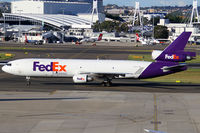 N619FE @ YSSY - taxi to cargo area - by Bill Mallinson