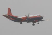 XS606 @ EGHH - On approach in foul weather - by John Coates