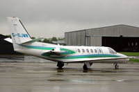 G-OJMW @ EGBJ - Citation Bravo at rainy Staverton airport. - by Henk van Capelle