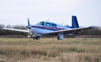 G-BJHB @ EGFH - Visiting Mooney 201 holding prior to departure. - by Roger Winser