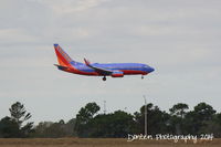 N241WN @ KMCO - Southwest Flight 1751 (N241WN) arrives at Orlando International Airport following a flght from New Orleans International Airport - by Donten Photography