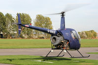 G-BSCE @ EGBR - Robinson R22 Beta at The Real Aeroplane Club's Pre-Hibernation Fly-In, Breighton Airfield, October 2013. - by Malcolm Clarke