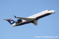 N401AW @ KSRQ - US Air Flight 4078 operated by Air Wisconsin (N401AW) departs Sarasota-Bradenton International Airport enroute to Reagan National Airport - by Donten Photography