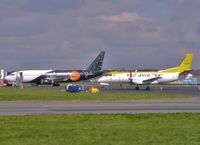 YL-RAH @ EGHH - On cargo apron with G-ZAPW - by John Coates