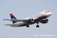 N763US @ KSRQ - US Air Flight 1801 (N763US) departs Sarasota-Bradenton International Airport enroute to Charlotte-Douglas International Airport - by Donten Photography