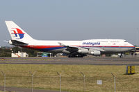 9M-MPK @ YSSY - taxi from 34L - by Bill Mallinson
