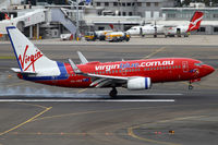 VH-VBZ @ YSSY - smoking on 16R - by Bill Mallinson