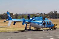 ZS-RJE @ FAGM - Bell 407 [53175] Johannesburg-Rand~ZS 21/09/2006 - by Ray Barber