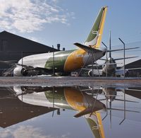 C-GOKF @ EGHH - Sat reflecting - by John Coates