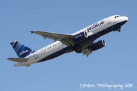 N588JB @ KSRQ - JetBlue Flight 164 (N588JB) Hopelessly Devoted to Blue departs Sarasota-Bradenton International Airport enroute to John F Kennedy International Airport - by Donten Photography