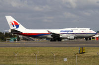 9M-MPK @ YSSY - taxiing after 34L landing - by Bill Mallinson