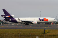 N613FE @ YSSY - rolling on 34L - by Bill Mallinson
