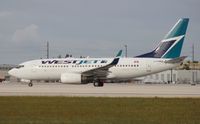 C-FIWS @ MIA - West Jet 737-700 - by Florida Metal