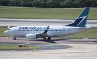 C-FWSX @ TPA - West Jet 737-700 - by Florida Metal