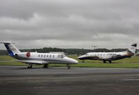 OK-XLS @ EGHH - Arriving at Signatures past N525DT - by John Coates