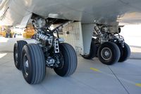 N476MC @ LOWG - B-747 main gear from the ground - by Paul H