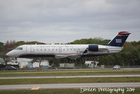 N439AW @ KSRQ - US Air Flight 4078 operated by Air Wisconsin (N439AW) arrives at Sarasota-Bradenton International Airprot following a flight from Reagan National Airport - by Donten Photography