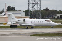 N9CU @ KSRQ - Learjet 60 (N9CU) taxis at Sarasota-Bradenton International Airport - by Donten Photography