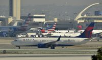N375DA @ KLAX - Taxiing to gate at LAX - by Todd Royer