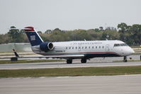 N468AW @ KSRQ - US Air Flight 4078 operated by Air Wisconsin (N468AW) taxis at Sarasota-Bradenton International Airport - by Donten Photography