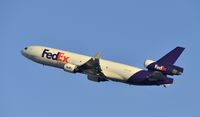 N596FE @ KLAX - Departing LAX on 25R - by Todd Royer