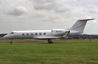 N124TF @ EGHH - Taxiing - by John Coates