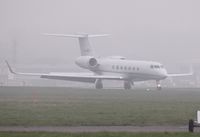 M-ARDI @ EGHH - Arriving through the fog. - by John Coates