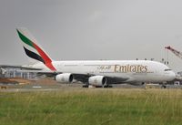 A6-EDH @ EGLL - Waiting at 27L - by John Coates