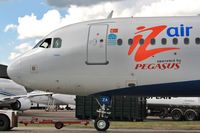 TC-IZA @ EGHH - Close up at paintshop - by John Coates