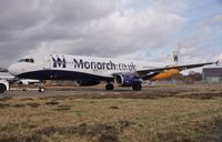 G-OZBO @ EGHH - Last appearance in this scheme - arriving at paintshop for latest livery - by John Coates
