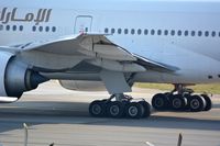 A6-ECJ @ LOWW - Left wing of B-777 - by Paul H