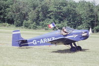 G-ARNZ @ LFFQ - Taxiing after landing at La Ferté-Alais, 2004 airshow, with a French flag to commemorate the centenary of the Entente Cordiale. - by J-F GUEGUIN