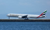 A6-ECK @ SFO - Landing at SFO on a cloudy day. - by Bill Larkins