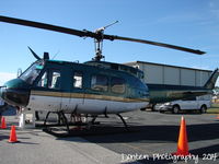N64586 @ KSRQ - Charlotte County Sheriff's Office UH-1 Iroquois (N64586) on display at Florida International Air Show - by Donten Photography