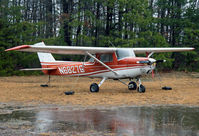 N6827G @ KMIV - This poor, wet Cessna 150 appears to be losing the battle in keeping dry on this dark, wet Saturday morning. - by Daniel L. Berek