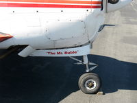 N5509D @ SZP - 1957 H35 BONANZA, Continental O-470-G 240 Hp, logo, Note hydraulic shimmy damper on nose gear - by Doug Robertson