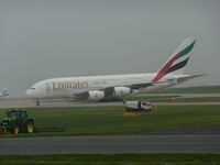 A6-EEI @ EGCC - dept the runway - by packo
